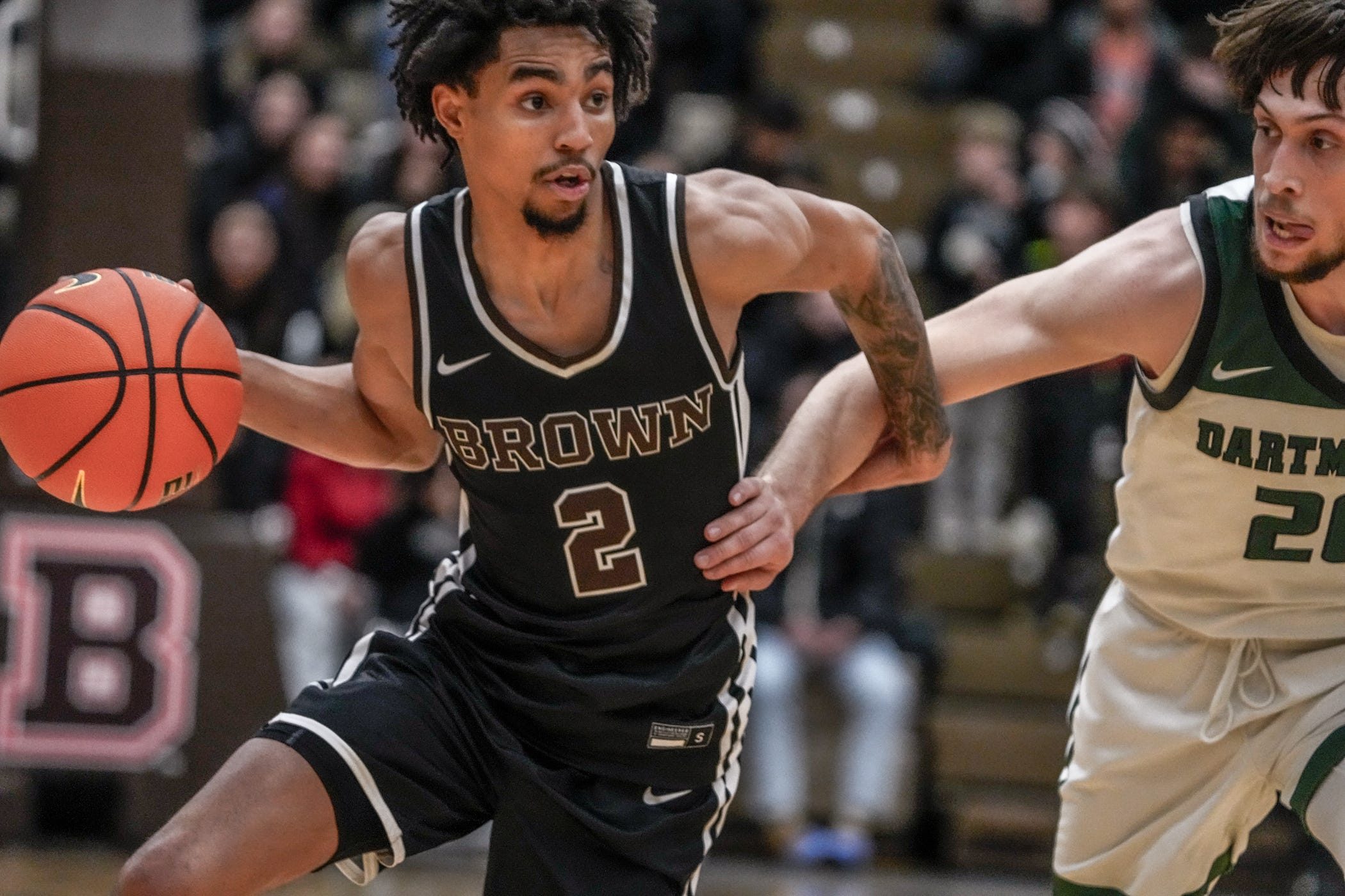 Brown falls to Dartmouth 84-83 at Pizzitola Sports Center. Bear's Jeremiah Jenkins drives by Romeo Myrthil