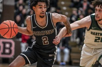 Brown falls to Dartmouth 84-83 at Pizzitola Sports Center. Bear's Jeremiah Jenkins drives by Romeo Myrthil