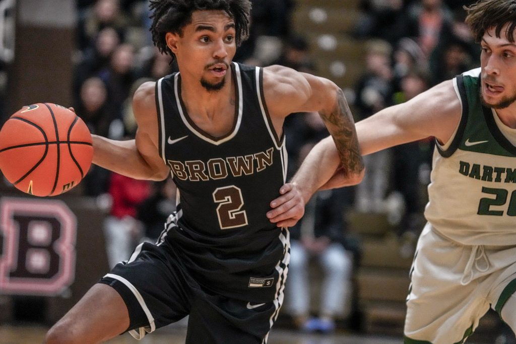 Brown falls to Dartmouth 84-83 at Pizzitola Sports Center. Bear's Jeremiah Jenkins drives by Romeo Myrthil