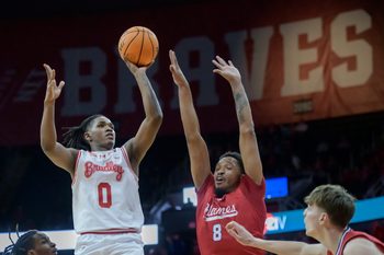 Bradley’s Demarion Burch (0) shoots over the UIC defense in the second half of their MVC basketball game Wednesday, Jan. 29, 2025 at Carver Arena in Peoria. The Braves fell 93-70 to the Flames.