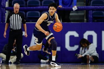 Feb 4, 2025; Colorado Springs, Colorado, USA; Nevada Wolf Pack guard Kobe Sanders (8) controls the ball in the second half against the Air Force Falcons at Clune Arena. Mandatory Credit: Isaiah J. Downing-Imagn Images