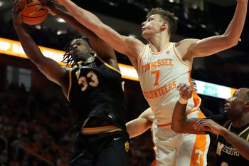 Missouri's Josh Gray (33) gets the rebound over Tennessee's Igor Miličić Jr. (7) during an NCAA college basketball game on Wednesday, Feb. 5, 2025, in Knoxville, Tenn.