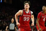 Feb 9, 2025; College Park, Maryland, USA; Rutgers Scarlet Knights center Zach Martini (99) rebounds during the second half against the Maryland Terrapins at Xfinity Center. Mandatory Credit: Reggie Hildred-Imagn Images