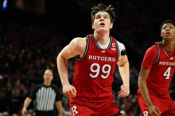 Feb 9, 2025; College Park, Maryland, USA; Rutgers Scarlet Knights center Zach Martini (99) rebounds during the second half against the Maryland Terrapins at Xfinity Center. Mandatory Credit: Reggie Hildred-Imagn Images