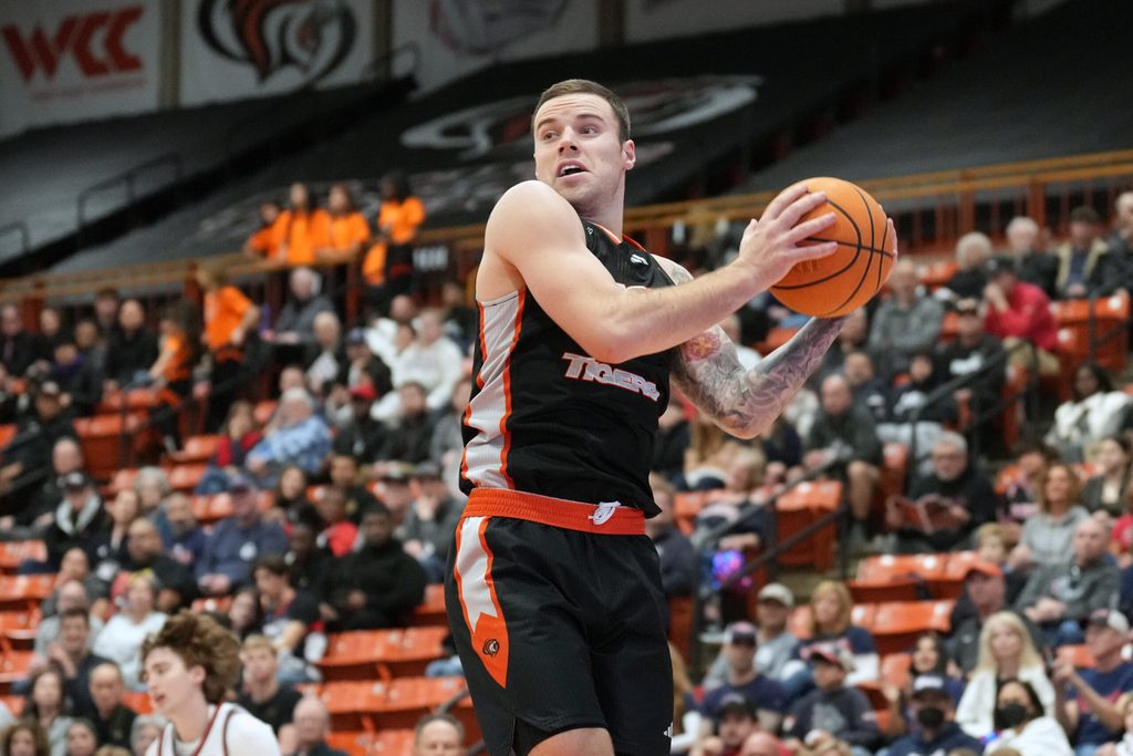 Feb 8, 2025; Stockton, California, USA; Pacific Tigers guard Petar Krivokapic (3) rebounds against the Gonzaga Bulldogs during the second half at Alex G. Spanos Center. Mandatory Credit: Darren Yamashita-Imagn Images