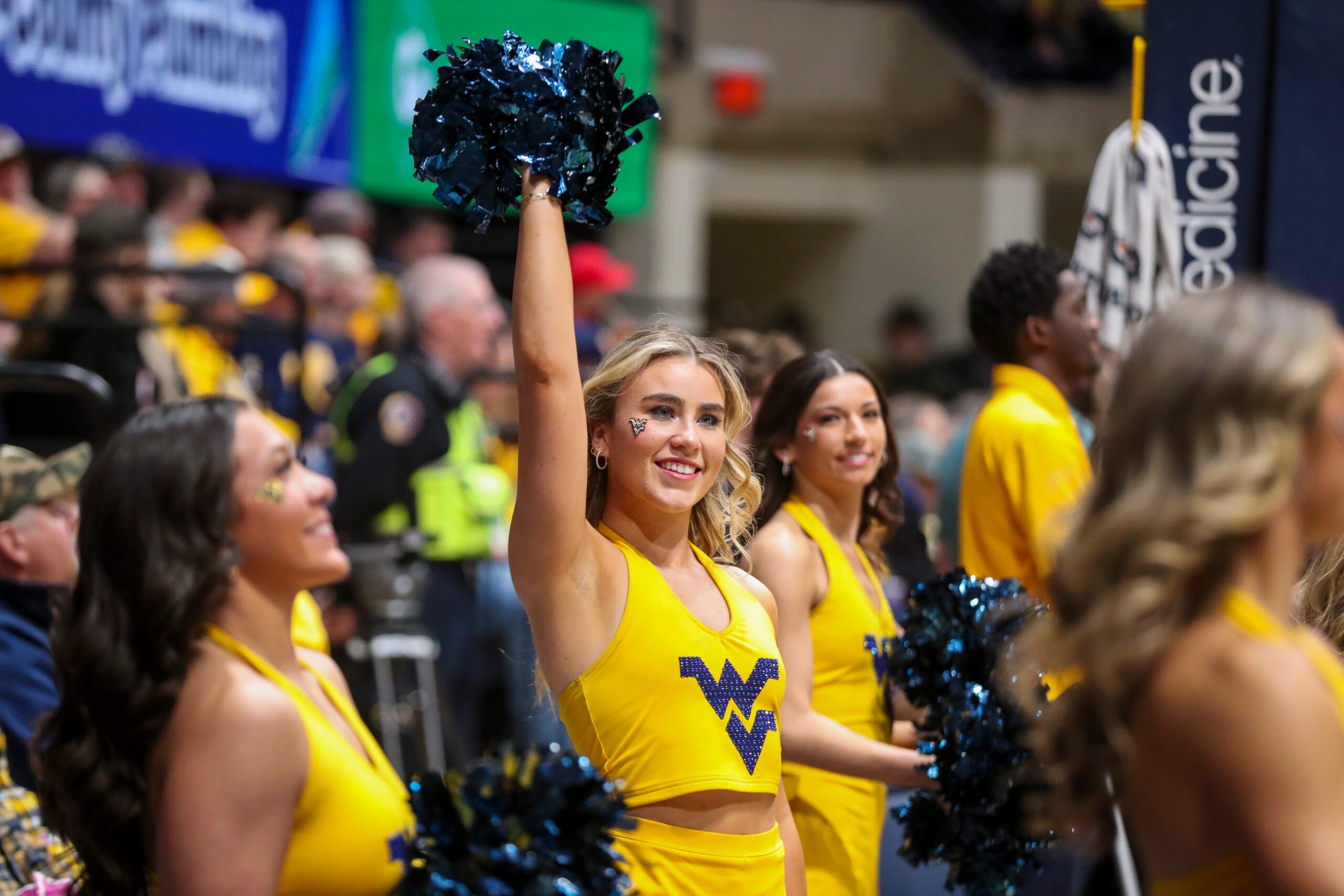 Feb 19, 2025; Morgantown, West Virginia, USA; A West Virginia Mountaineers cheerleader performs during the first half against the Cincinnati Bearcats at WVU Coliseum. Mandatory Credit: Ben Queen-Imagn Images