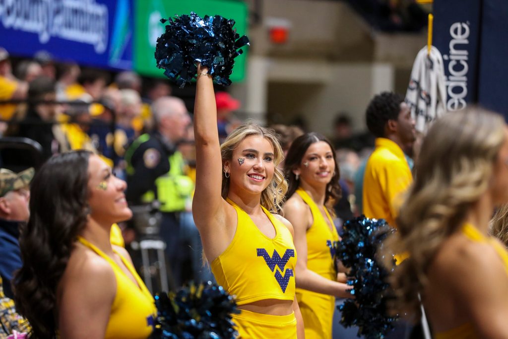 Feb 19, 2025; Morgantown, West Virginia, USA; A West Virginia Mountaineers cheerleader performs during the first half against the Cincinnati Bearcats at WVU Coliseum. Mandatory Credit: Ben Queen-Imagn Images