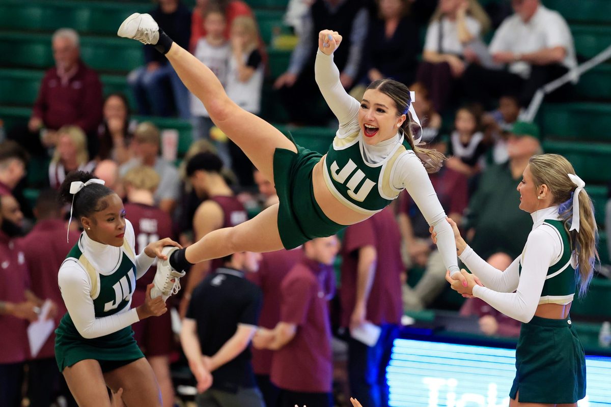 Jacksonville Dolphins cheerleaders perform a stunt during a time out during the second half of the quarterfinal round of the ASUN men’s basketball tournament at Swisher Gymnasium Monday, March 2, 2025 in Jacksonville, Fla. JU rallied to defeat EKU 78-67. [Corey Perrine/Florida Times-Union]
