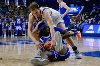 Mar 4, 2025; Colorado Springs, Colorado, USA; Boise State Broncos forward O'Mar Stanley (1) and Air Force Falcons center Wesley Celichowski (51) battle for the ball in the second half at Clune Arena. Mandatory Credit: Isaiah J. Downing-Imagn Images