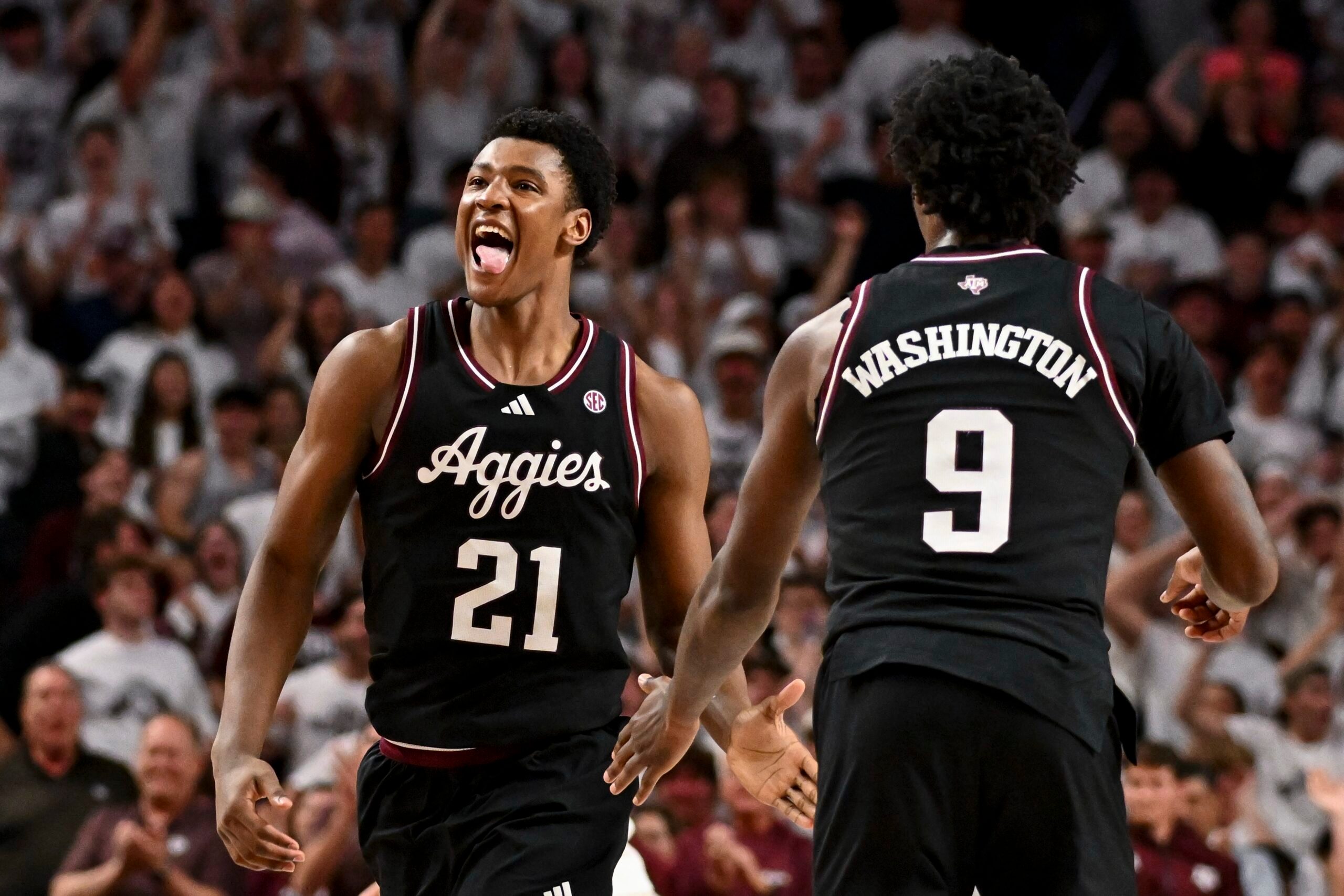 Mar 4, 2025; College Station, Texas, USA; Texas A&M Aggies forward Pharrel Payne (21) rects during the second half against the Auburn Tigers at Reed Arena. Mandatory Credit: Maria Lysaker-Imagn Images