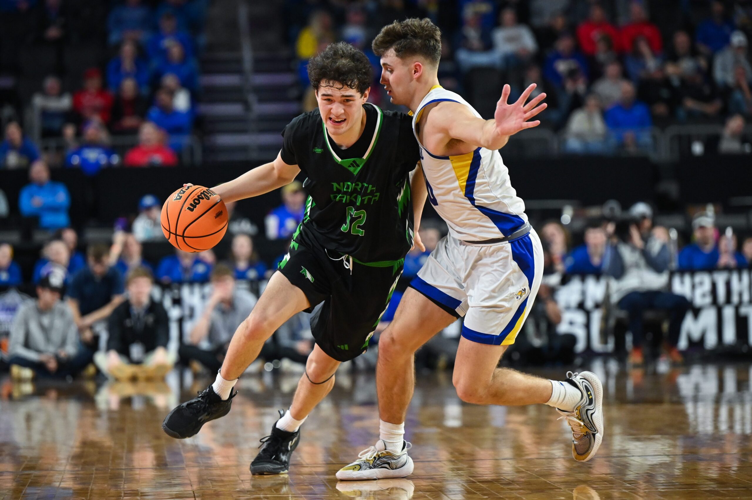 North Dakota Fighting Hawks guard Treysen Eaglestaff (52) brings the ball up court on Friday, March 7, 2025, at Denny Sanford Premier Center in Sioux Falls, S.D.