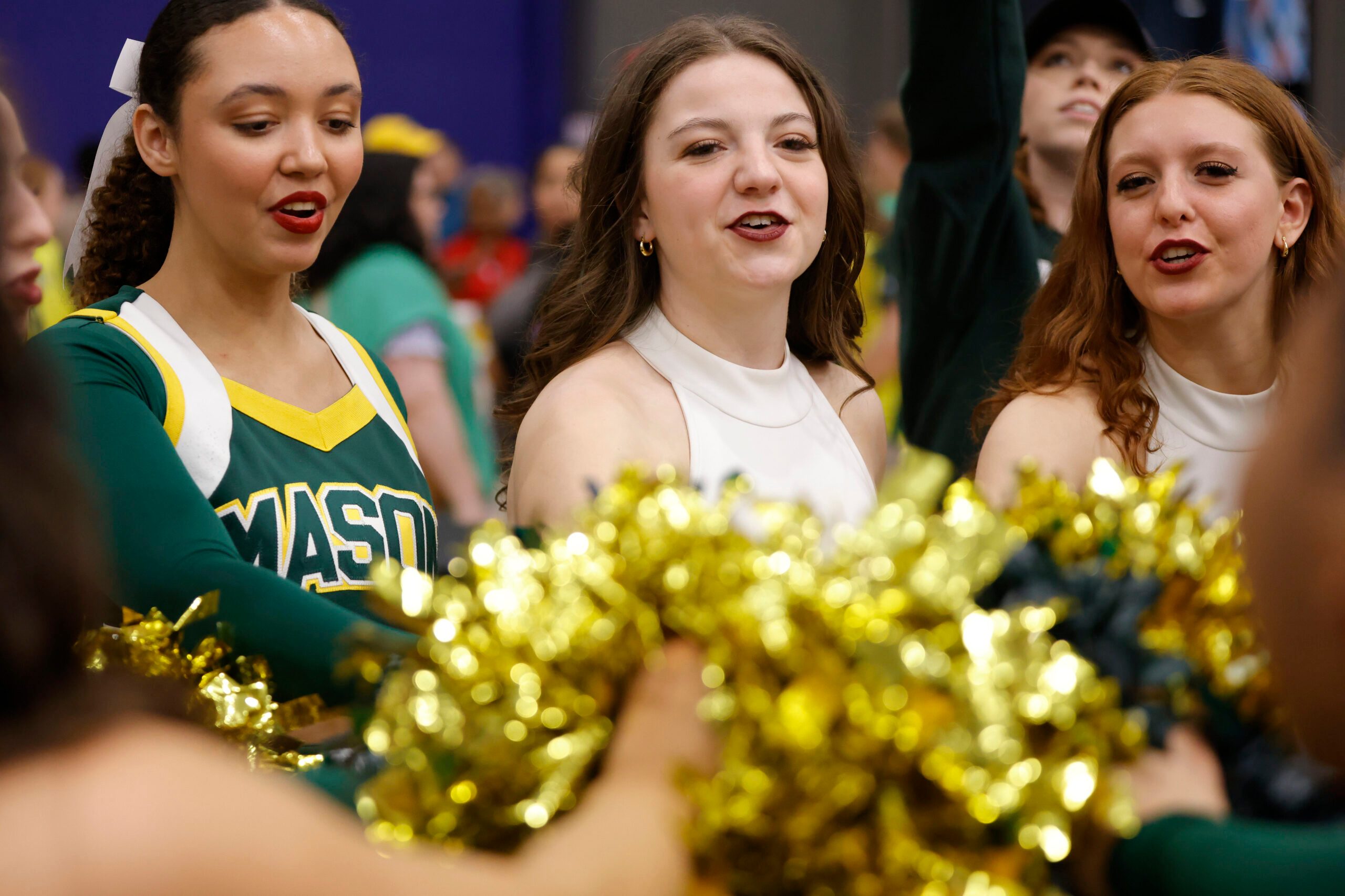 Mar 8, 2025; Henrico, VA, USA; George Mason Patriots cheerleaders and dance team members huddle after the Patriots’ defeated the Davidson Wildcats at Henrico Sports & Events Center. Mandatory Credit: Amber Searls-Imagn Images