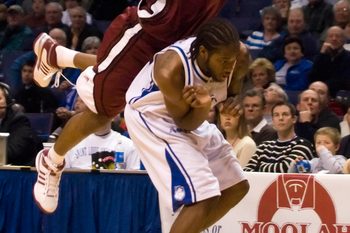 Feb 2, 2008; St, Louis, MO, USA; Massachusetts Minutemens guard/forward Gary Forbes (3) puts up a three pointer and is fouled by Saint Louis Billikens guard Tommie Liddell (25) during the 2nd half at the Scottrade Center. Saint Louis went on to defeat Massachusetts 71-59.  Mandatory Credit: Jeff Curry-Imagn Images
