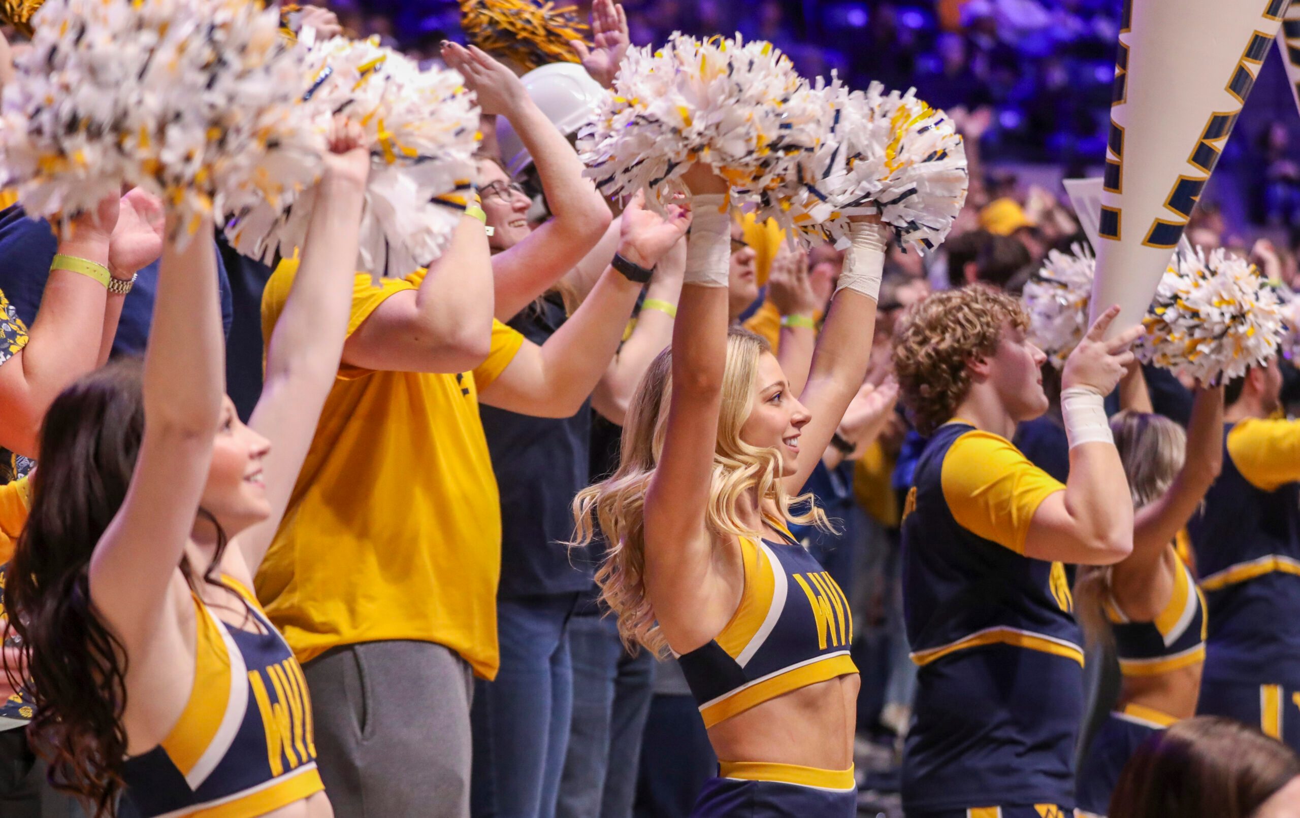 Mar 8, 2025; Morgantown, West Virginia, USA; West Virginia Mountaineers cheerleaders perform during the second half against the UCF Knights at WVU Coliseum. Mandatory Credit: Ben Queen-Imagn Images