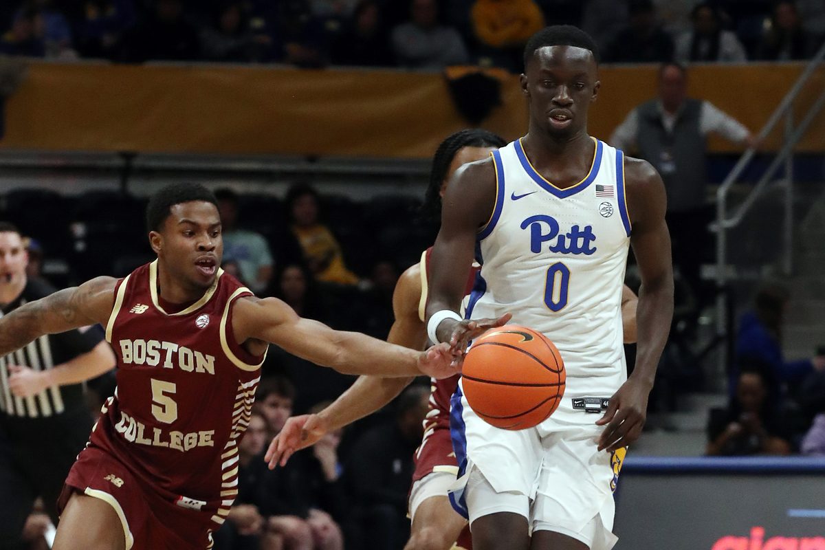 Mar 8, 2025; Pittsburgh, Pennsylvania, USA;  Boston College Eagles guard Fred Payne (5) steals the ball from Pittsburgh Panthers forward Amdy Ndiaye (0) during the second half at the Petersen Events Center. Mandatory Credit: Charles LeClaire-Imagn Images