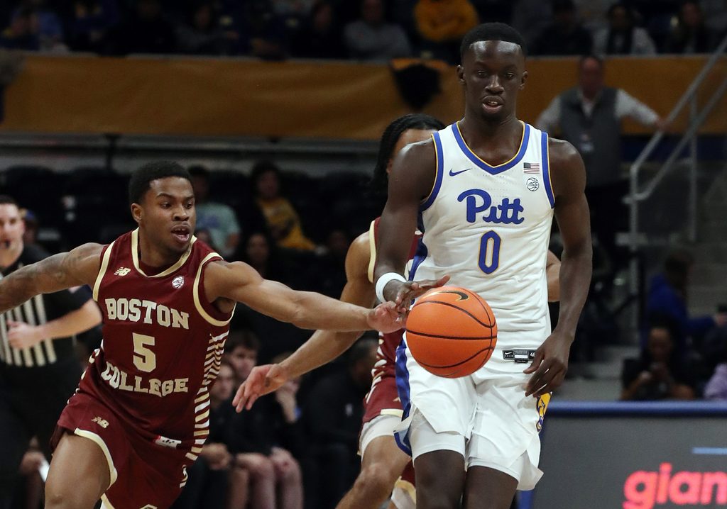 Mar 8, 2025; Pittsburgh, Pennsylvania, USA; Boston College Eagles guard Fred Payne (5) steals the ball from Pittsburgh Panthers forward Amdy Ndiaye (0) during the second half at the Petersen Events Center. Mandatory Credit: Charles LeClaire-Imagn Images