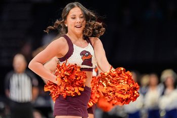 Mar 11, 2025; Charlotte, NC, USA; Virginia Tech Hokies cheerleaders during the first half against the California Golden Bears at Spectrum Center. Mandatory Credit: Jim Dedmon-Imagn Images
