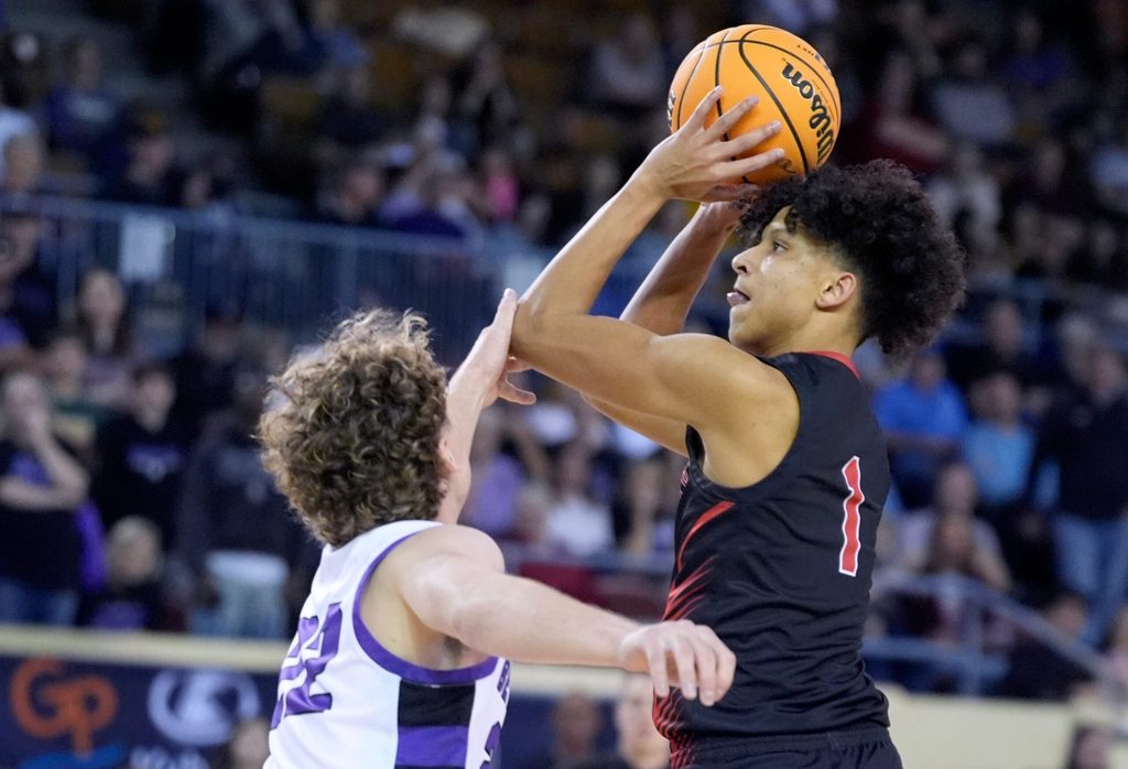 North Rock Creek's Memphis Burdine shoots over Bethany's Garrett Johnson during the Class 4A boys Oklahoma state basketball championship tournament game between Bethany and North Rock Creek at State Fair Arena in Oklahoma City, Wednesday, March, 12, 2025.