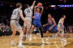 Mar 12, 2025; New York, NY, USA; DePaul Blue Demons guard CJ Gunn (11) takes a shot against Georgetown Hoyas guard Jayden Epps (10) and forward Drew Fielder (20) during the first half at Madison Square Garden. Mandatory Credit: Brad Penner-Imagn Images