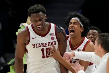 Mar 12, 2025; Charlotte, NC, USA; Stanford Cardinal forward Chisom Okpara (10) reacts with guard Ryan Agarwal (11) after scoring a basket and being fouled late in the second half at Spectrum Center. Mandatory Credit: Bob Donnan-Imagn Images