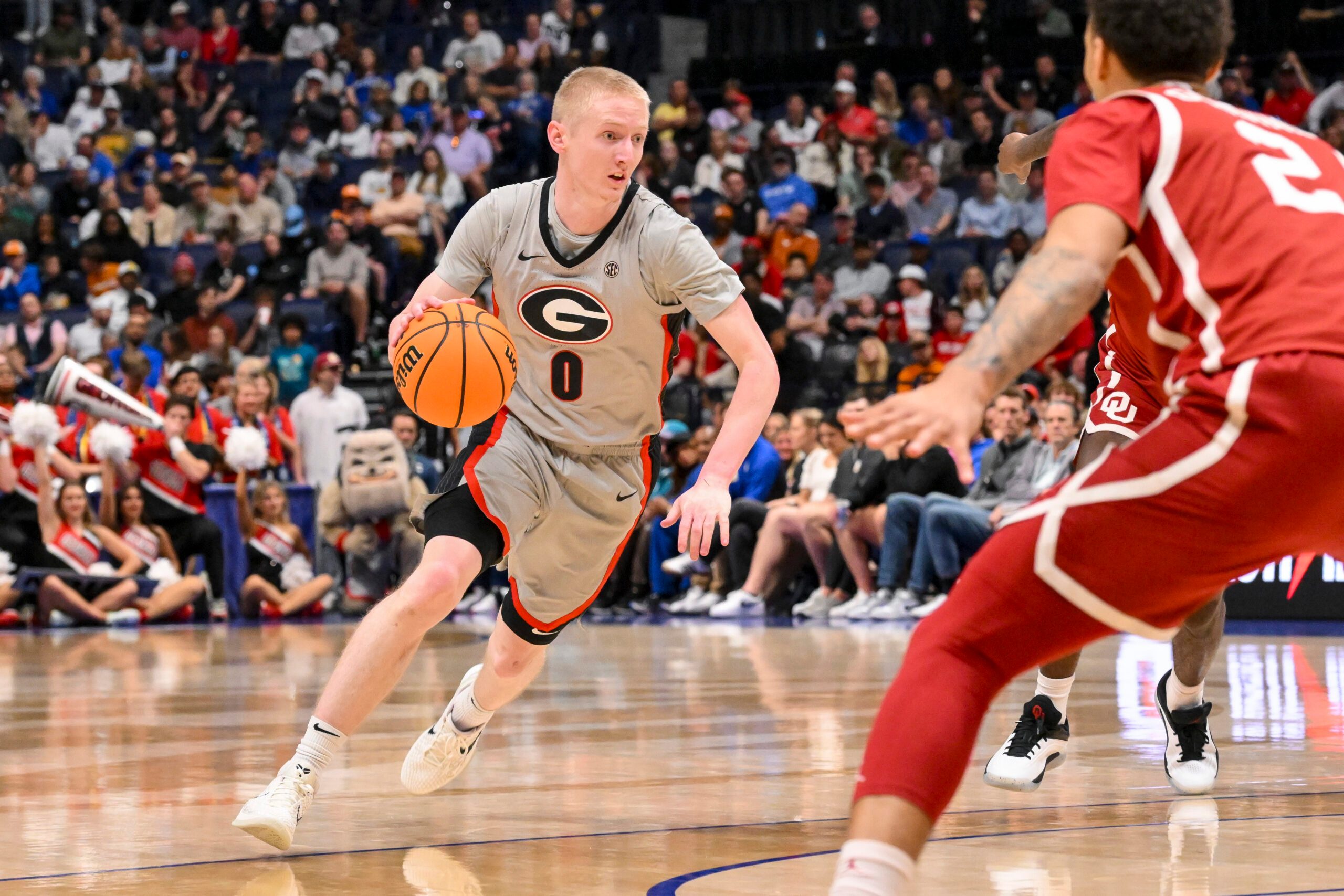 Mar 12, 2025; Nashville, TN, USA;  Georgia Bulldogs guard Blue Cain (0) dribbles the ball against the Oklahoma Sooners during the first half at Bridgestone Arena. Mandatory Credit: Steve Roberts-Imagn Images