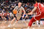 Mar 12, 2025; Nashville, TN, USA;  Georgia Bulldogs guard Blue Cain (0) dribbles the ball against the Oklahoma Sooners during the first half at Bridgestone Arena. Mandatory Credit: Steve Roberts-Imagn Images