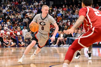Mar 12, 2025; Nashville, TN, USA;  Georgia Bulldogs guard Blue Cain (0) dribbles the ball against the Oklahoma Sooners during the first half at Bridgestone Arena. Mandatory Credit: Steve Roberts-Imagn Images
