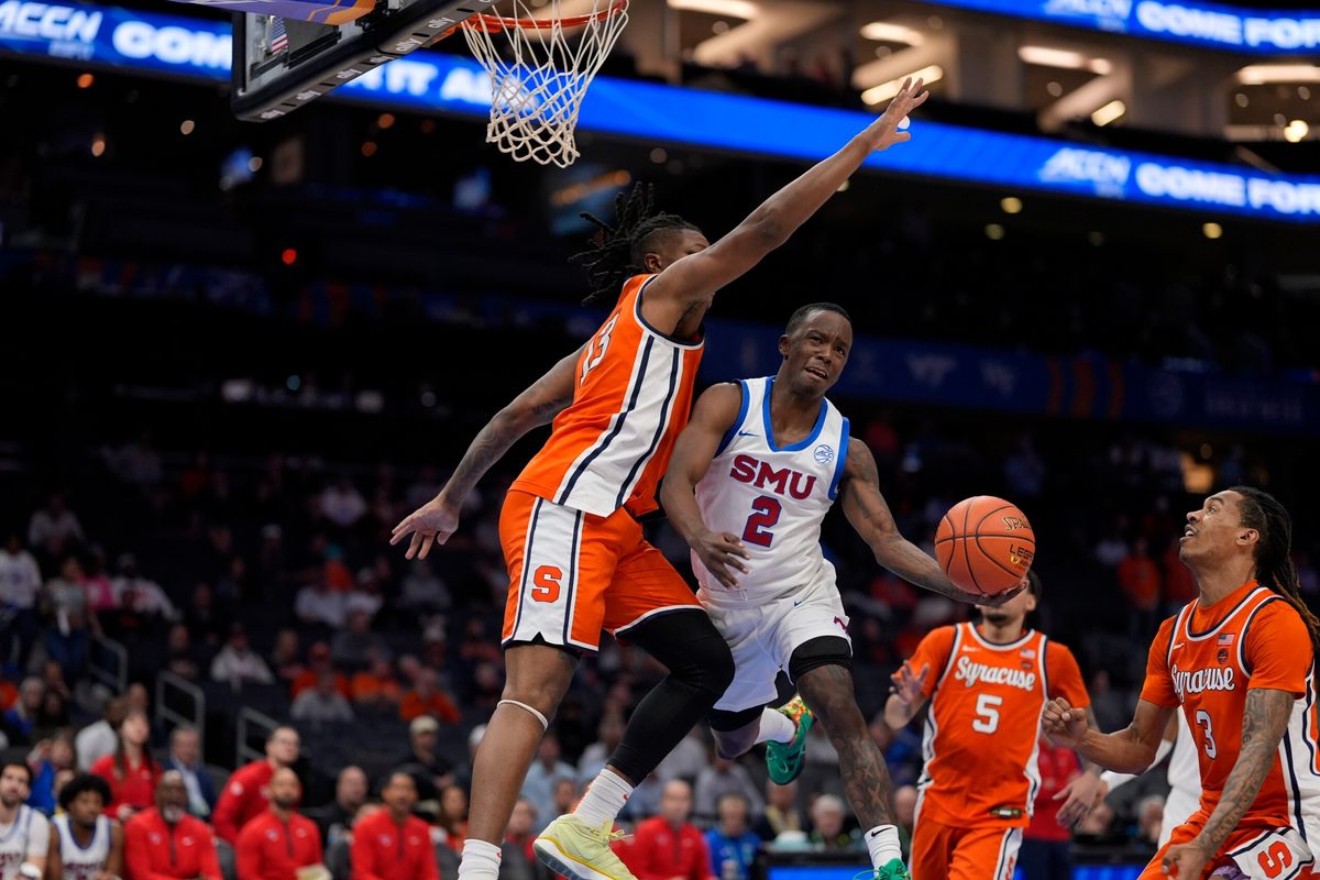 Mar 12, 2025; Charlotte, NC, USA; Southern Methodist Mustangs guard Boopie Miller (2) goes up for a layup against Syracuse Orange forward Jyare Davis (13) during the second half at Spectrum Center. Mandatory Credit: Jim Dedmon-Imagn Images