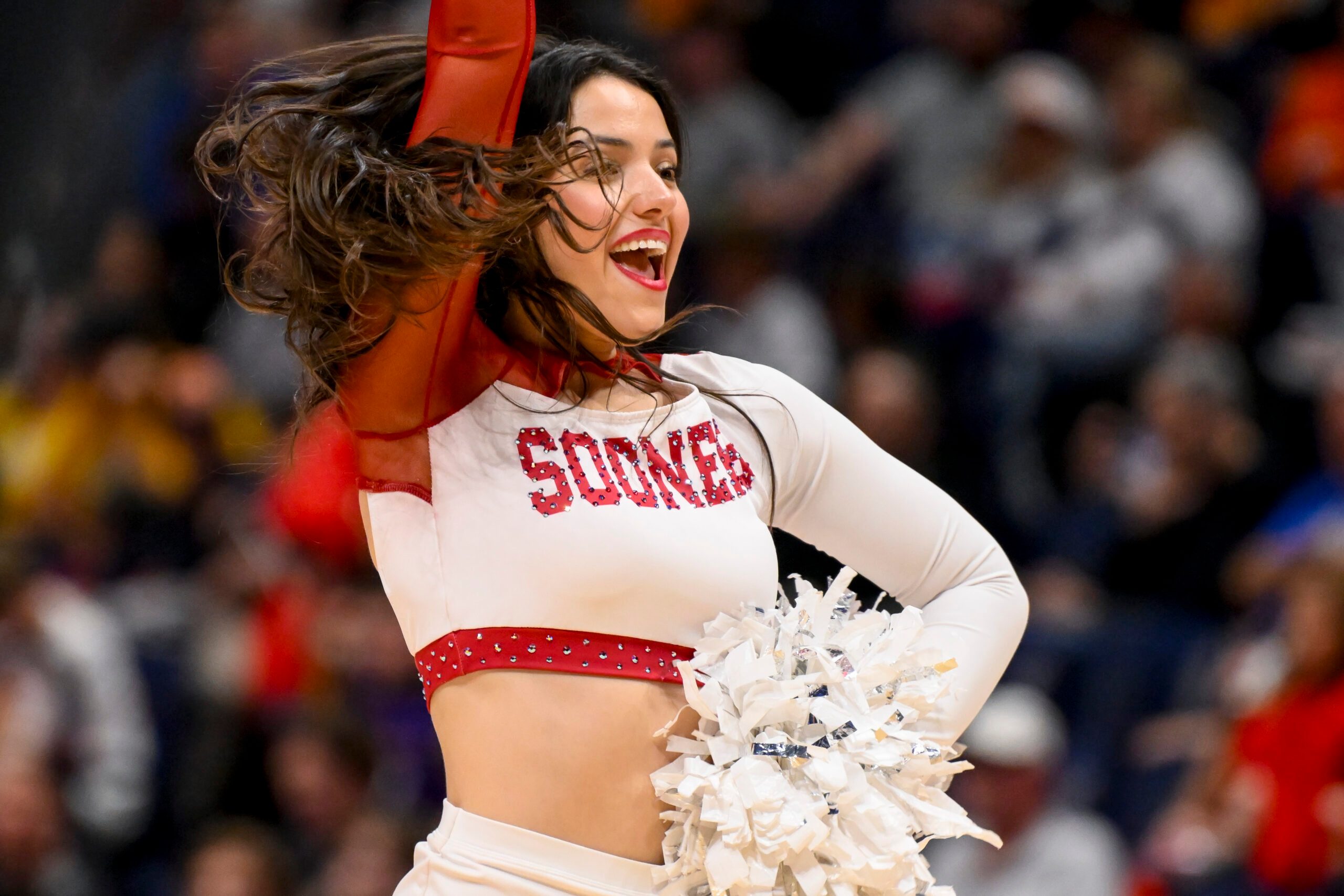 Mar 12, 2025; Nashville, TN, USA;  Oklahoma Sooners cheerleader during a time out against the Georgia Bulldogs during the second half at Bridgestone Arena. Mandatory Credit: Steve Roberts-Imagn Images