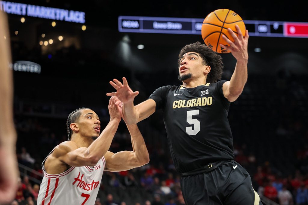 Mar 13, 2025; Kansas City, MO, USA; Colorado Buffaloes guard RJ Smith (5) drives to the basket during the second half against the Houston Cougars at T-Mobile Center. Mandatory Credit: William Purnell-Imagn Images