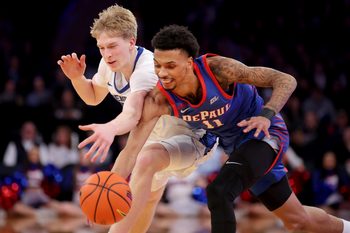 Mar 13, 2025; New York, NY, USA; Creighton Bluejays forward Jackson McAndrew (23) and DePaul Blue Demons guard CJ Gunn (11) fight for a loose ball during the second half at Madison Square Garden. Mandatory Credit: Brad Penner-Imagn Images