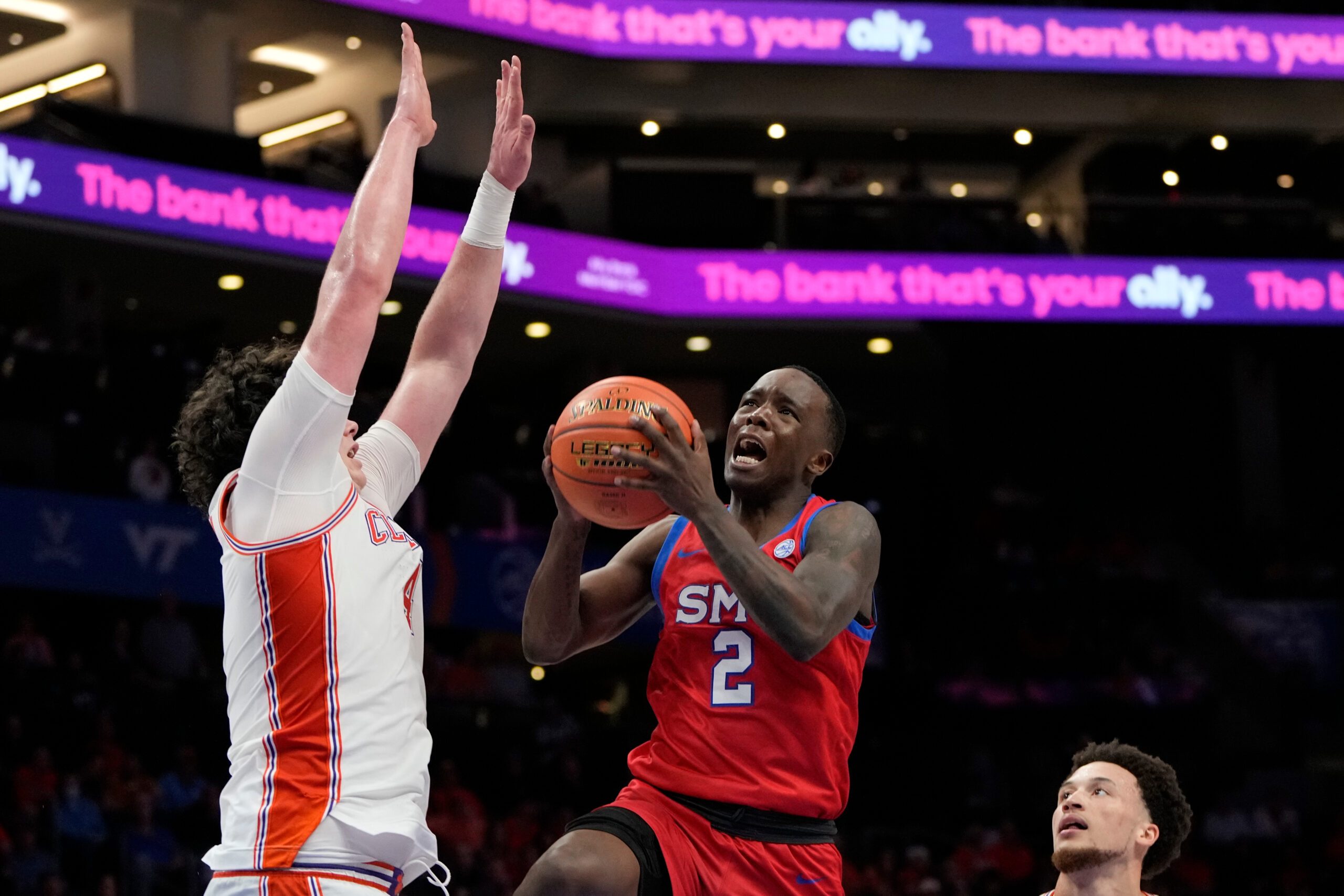 Mar 13, 2025; Charlotte, NC, USA; Southern Methodist Mustangs guard Boopie Miller (2) shoots as Clemson Tigers forward Ian Schieffelin (4) defends in the second half at Spectrum Center. Mandatory Credit: Bob Donnan-Imagn Images