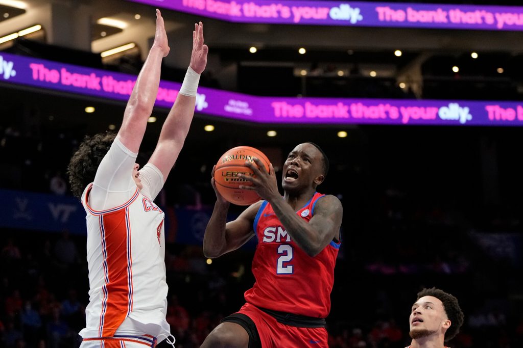 Mar 13, 2025; Charlotte, NC, USA; Southern Methodist Mustangs guard Boopie Miller (2) shoots as Clemson Tigers forward Ian Schieffelin (4) defends in the second half at Spectrum Center. Mandatory Credit: Bob Donnan-Imagn Images