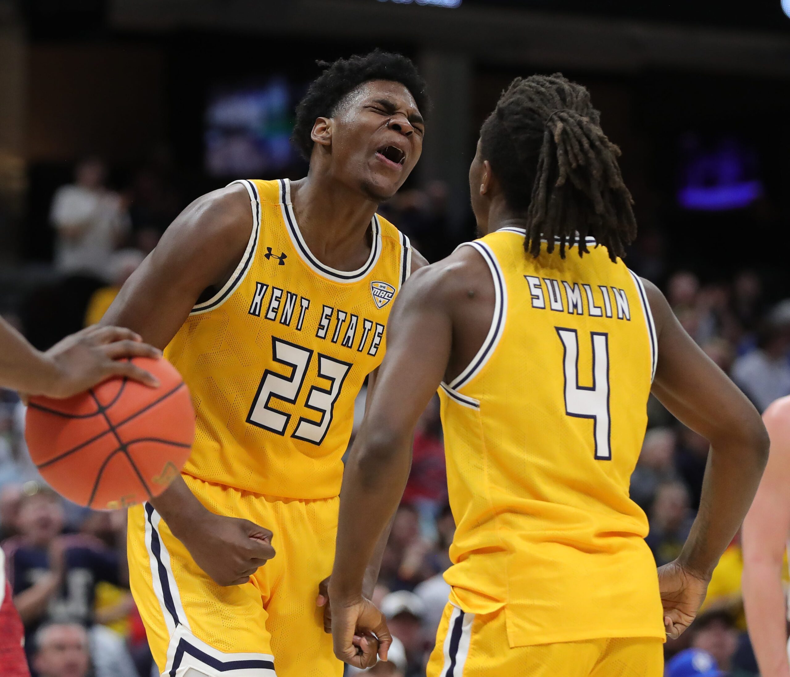 Kent State Golden Flashes forward Delrecco Gillespie (23) celebrates with guard Jamal Sumlin (4) during the second half of an NCAA college basketball game in the semifinals of the Mid-American Conference Tournament at Rocket Arena on Friday, March 14, 2025, in Cleveland, Ohio.