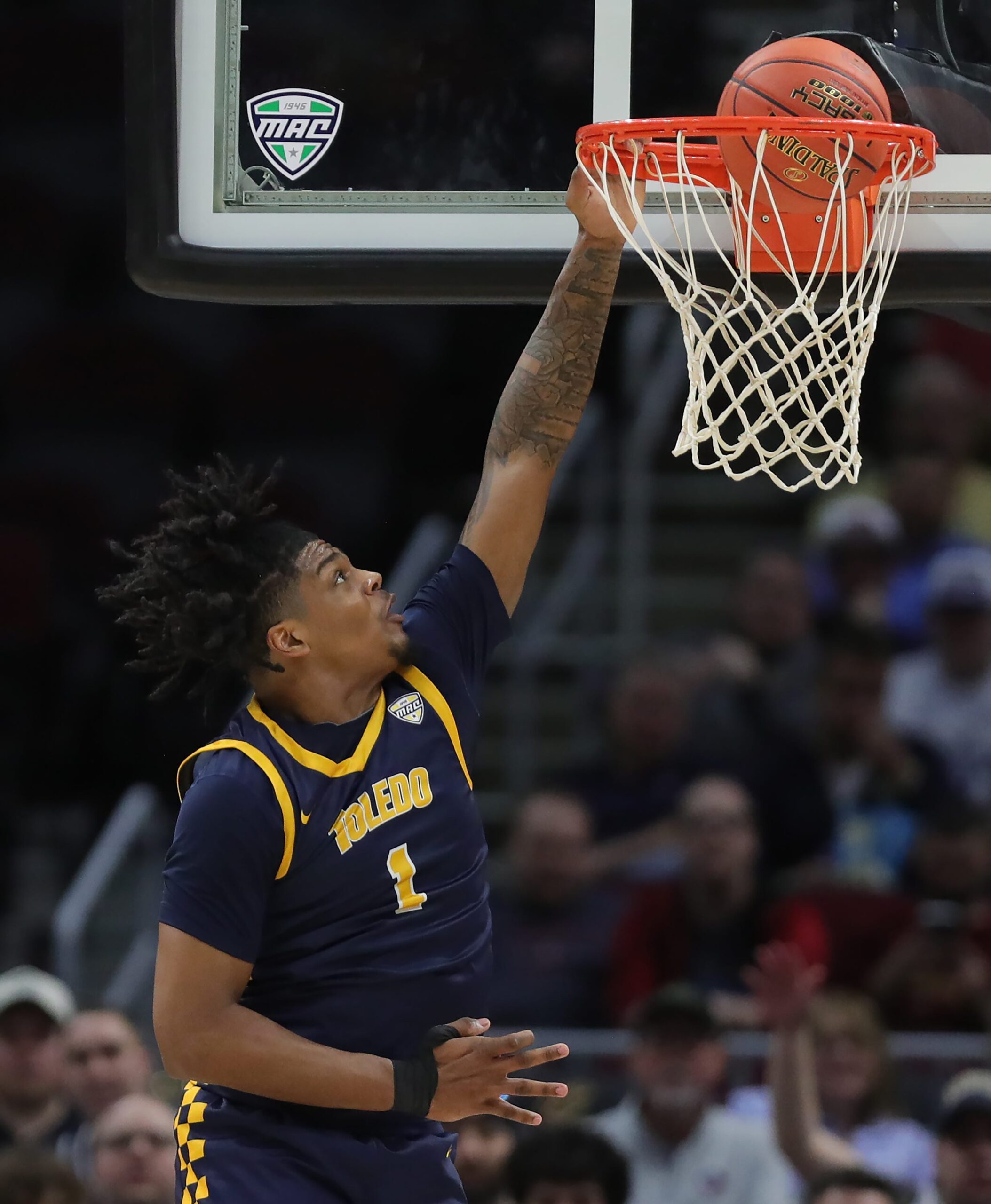 Toledo Rockets forward Javan Simmons (1) dunks during the first half of an NCAA college basketball game in the semifinals of the Mid-American Conference Tournament at Rocket Arena on Friday, March 14, 2025, in Cleveland, Ohio.