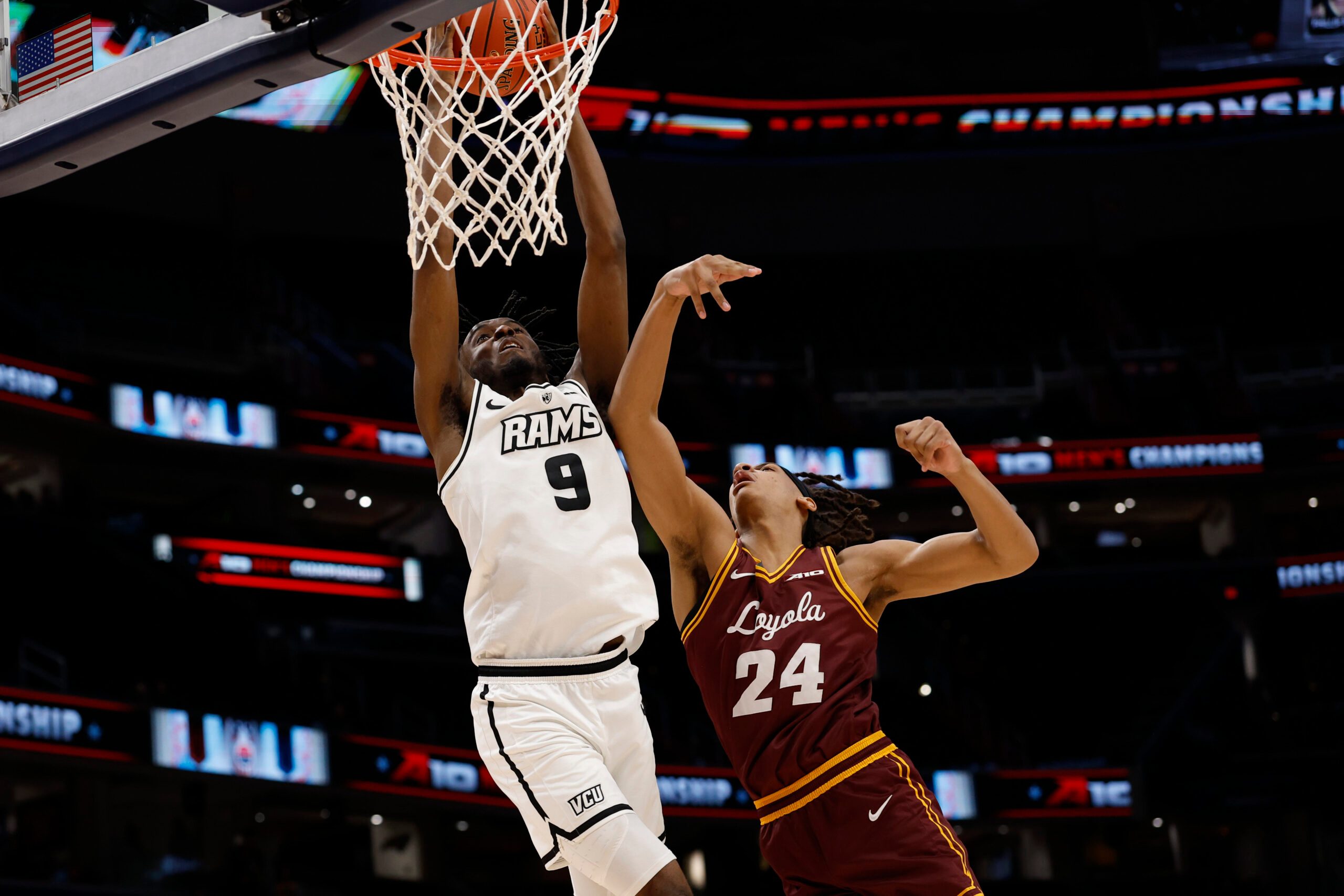 Mar 15, 2025; Washington, D.C., USA; VCU Rams forward Luke Bamgboye (9) is fouled while attempting to dunk the ball by Loyola Chicago Ramblers center Miles Rubin (24) in the second half at Capital One Arena. Mandatory Credit: Geoff Burke-Imagn Images