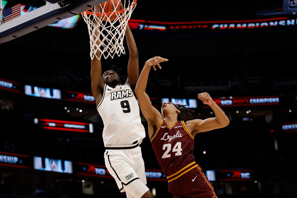 Mar 15, 2025; Washington, D.C., USA; VCU Rams forward Luke Bamgboye (9) is fouled while attempting to dunk the ball by Loyola Chicago Ramblers center Miles Rubin (24) in the second half at Capital One Arena. Mandatory Credit: Geoff Burke-Imagn Images