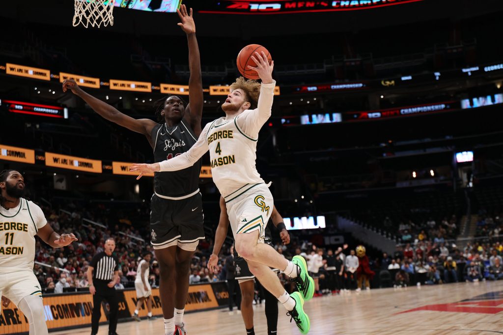 Mar 15, 2025; Washington, D.C., USA; George Mason Patriots guard Brayden O'Connor (4) shoots the ball as Saint Joseph's Hawks forward Rasheer Fleming (13) defends in the second half at Capital One Arena. Mandatory Credit: Geoff Burke-Imagn Images