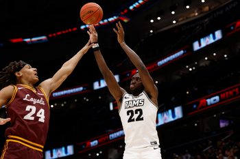 Mar 15, 2025; Washington, D.C., USA; VCU Rams guard Joe Bamisile (22) shoots the ball over Loyola Chicago Ramblers center Miles Rubin (24) in the second half at Capital One Arena. Mandatory Credit: Geoff Burke-Imagn Images