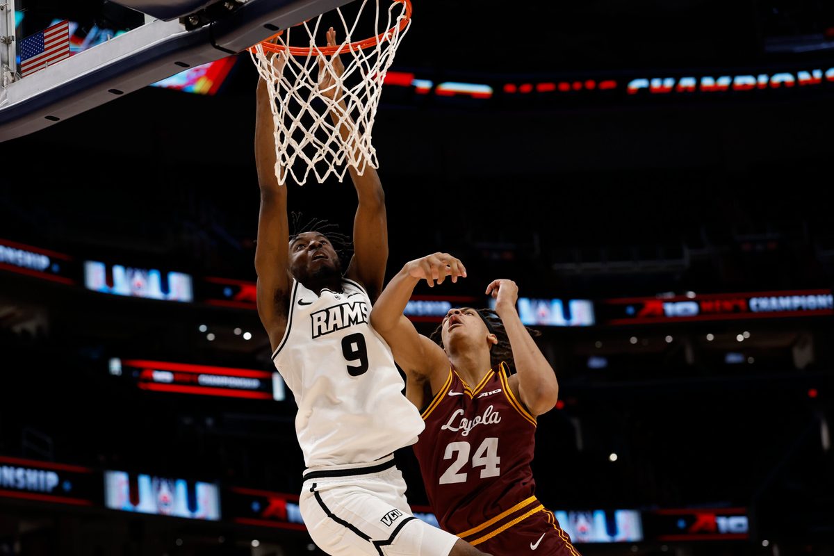 Mar 15, 2025; Washington, D.C., USA; VCU Rams forward Luke Bamgboye (9) is fouled while attempting to dunk the ball by Loyola Chicago Ramblers center Miles Rubin (24) in the second half at Capital One Arena. Mandatory Credit: Geoff Burke-Imagn Images