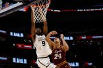 Mar 15, 2025; Washington, D.C., USA; VCU Rams forward Luke Bamgboye (9) is fouled while attempting to dunk the ball by Loyola Chicago Ramblers center Miles Rubin (24) in the second half at Capital One Arena. Mandatory Credit: Geoff Burke-Imagn Images