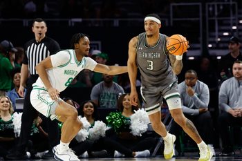 Mar 15, 2025; Fort Worth, TX, USA;  UAB Blazers forward Yaxel Lendeborg (3) looks to pass against North Texas Mean Green forward Grant Newell (8) during the first half at Dickies Arena. Mandatory Credit: Chris Jones-Imagn Images
