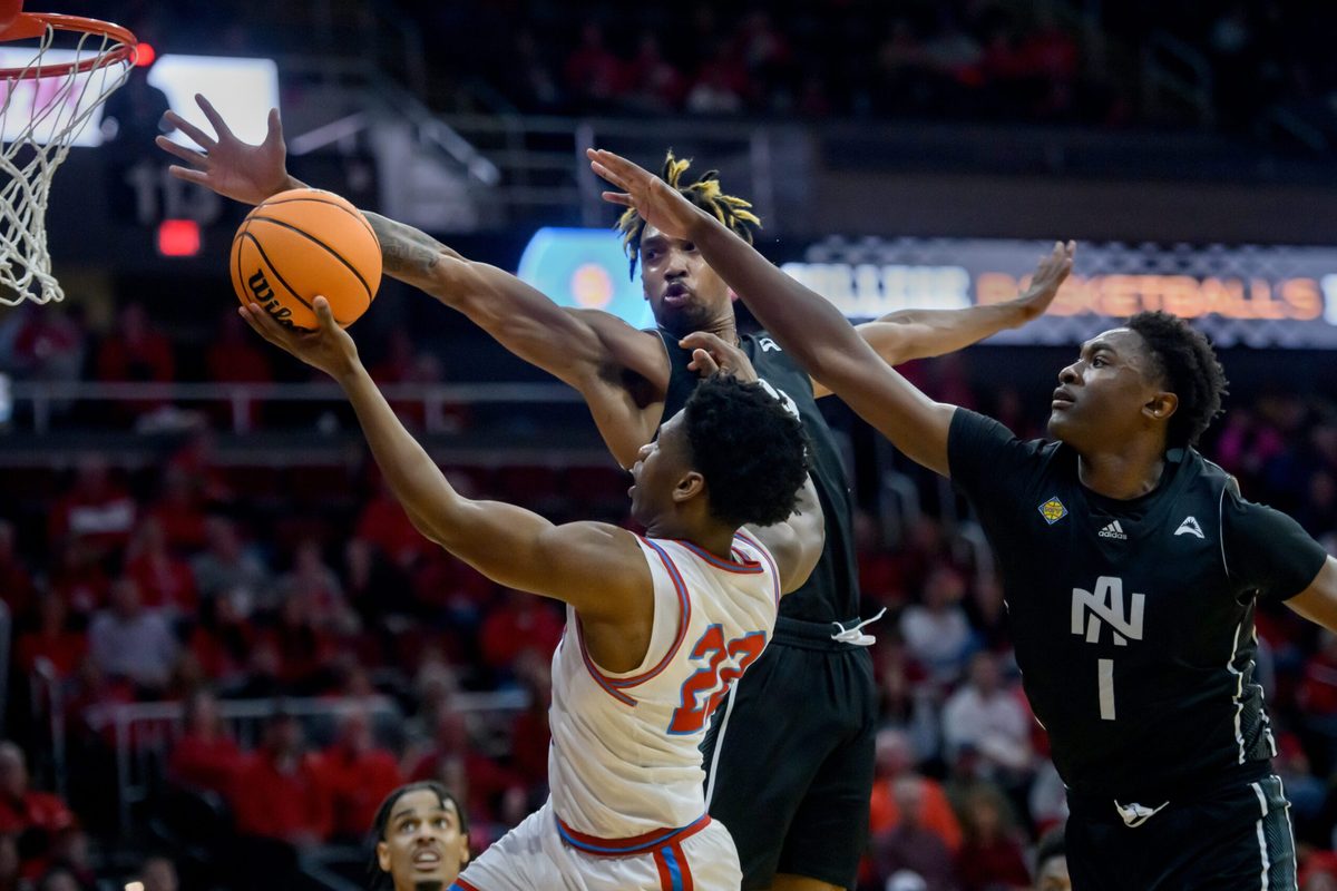 Bradley’s Jaquan Johnson (22) goes to the basket against North Alabama’s Donte Bacchus (1) and Corneilous Williams in the first half of their first-round NIT basketball game Wednesday, March 19, 2025. The Braves advanced with a 71-62 victory.
