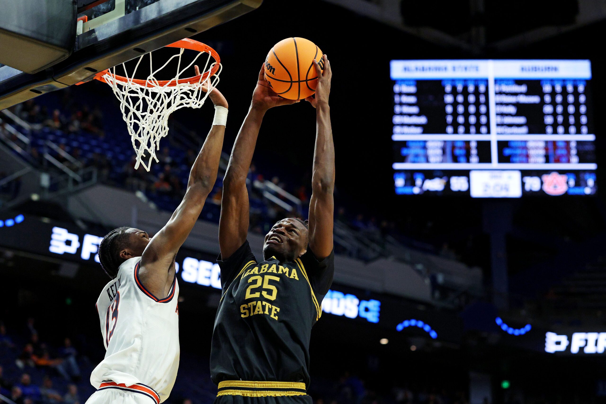 Mar 20, 2025; Lexington, KY, USA; Alabama State Hornets forward Jasteven Walker (25) shoots the ball against Auburn Tigers guard Miles Kelly (13) during the second half in the first round of the NCAA Tournament at Rupp Arena. Mandatory Credit: Jordan Prather-Imagn Images