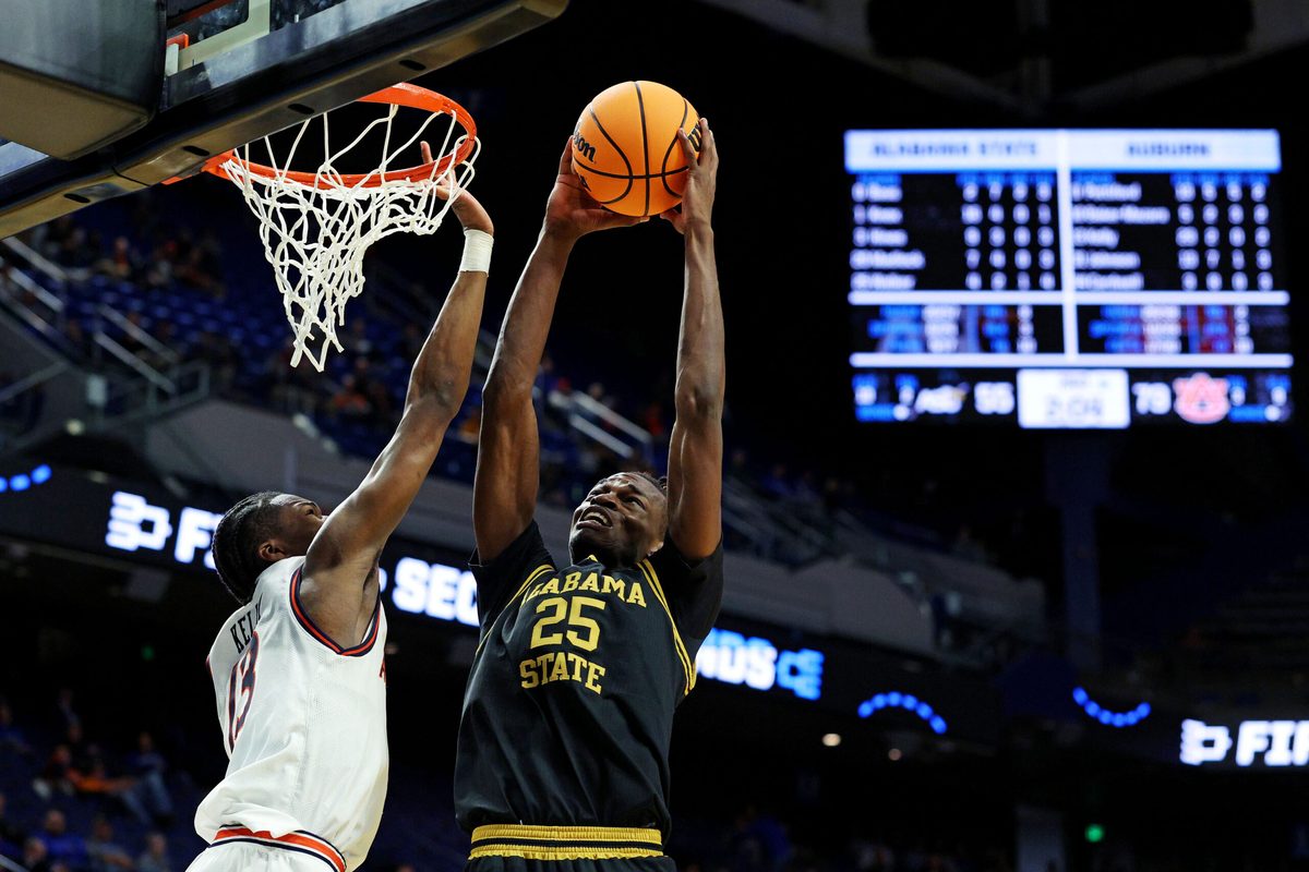 Mar 20, 2025; Lexington, KY, USA; Alabama State Hornets forward Jasteven Walker (25) shoots the ball against Auburn Tigers guard Miles Kelly (13) during the second half in the first round of the NCAA Tournament at Rupp Arena. Mandatory Credit: Jordan Prather-Imagn Images