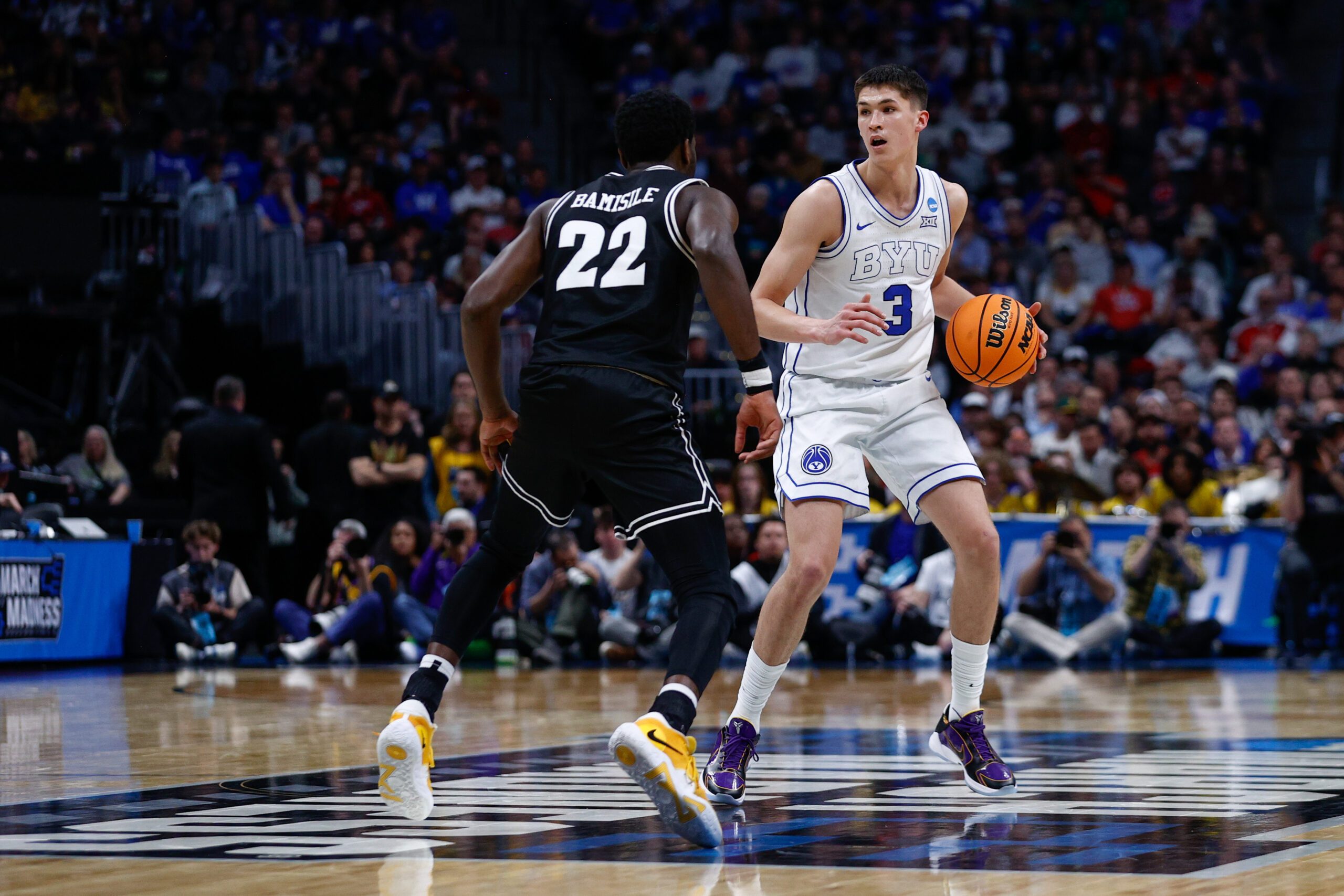 Mar 20, 2025; Denver, CO, USA; VCU Rams guard Joe Bamisile (22) defends against Brigham Young Cougars guard Egor Demin (3) during the second half in the first round of the NCAA Tournament at Ball Arena. Mandatory Credit: Isaiah J. Downing-Imagn Images
