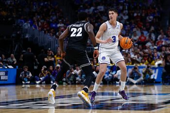 Mar 20, 2025; Denver, CO, USA; VCU Rams guard Joe Bamisile (22) defends against Brigham Young Cougars guard Egor Demin (3) during the second half in the first round of the NCAA Tournament at Ball Arena. Mandatory Credit: Isaiah J. Downing-Imagn Images