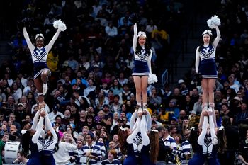 March 20, 2025; Denver, CO, USA; Yale Bulldogs cheerleaders preforms during half-time against the Texas A&M Aggies at Ball Arena. Mandatory Credit: Ron Chenoy-Imagn Images