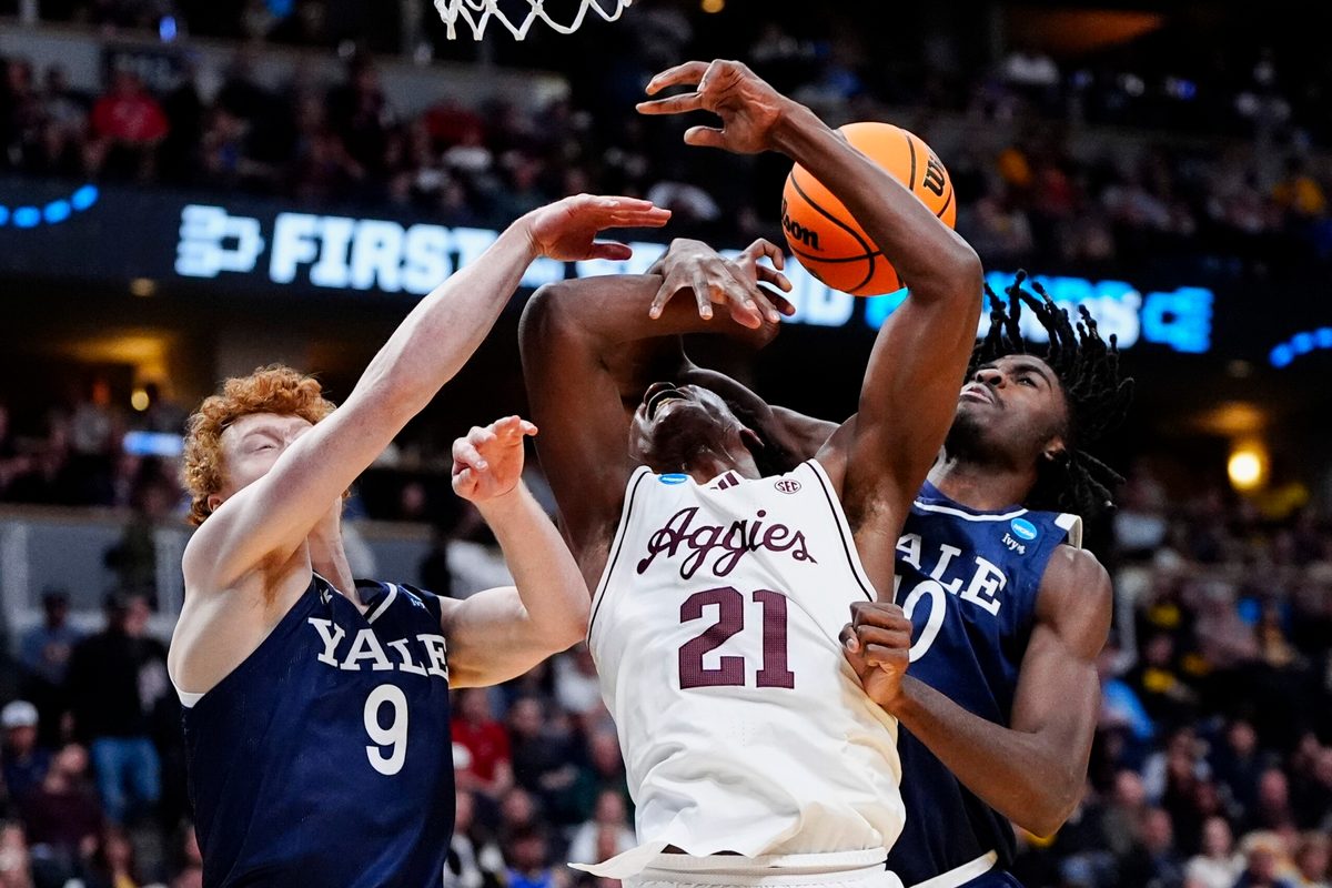 March 20, 2025; Denver, CO, USA; Texas A&M Aggies forward Pharrel Payne (21) is fouled by Yale Bulldogs center Samson Aletan (10) as forward Riley Fox (9) defends during the second half at Ball Arena. Mandatory Credit: Ron Chenoy-Imagn Images
