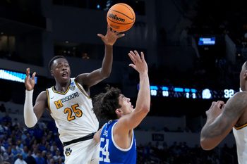 Mar 20, 2025; Wichita, KS, USA; Missouri Tigers guard Mark Mitchell (25) passes against Drake Bulldogs forward Daniel Abreu (54) in the first half of a first round men’s NCAA Tournament game at Intrust Bank Arena. Mandatory Credit: Kirby Lee-Imagn Images